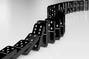 Black dominoes falling
